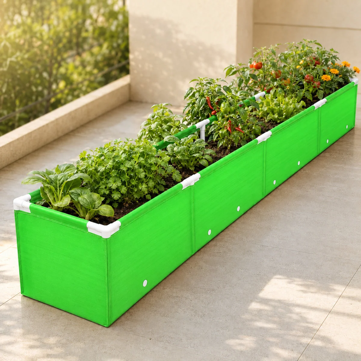 10 × 1 × 1 ft green HDPE grow bag bed planted with herbs, chillies and tomatoes on a terrace